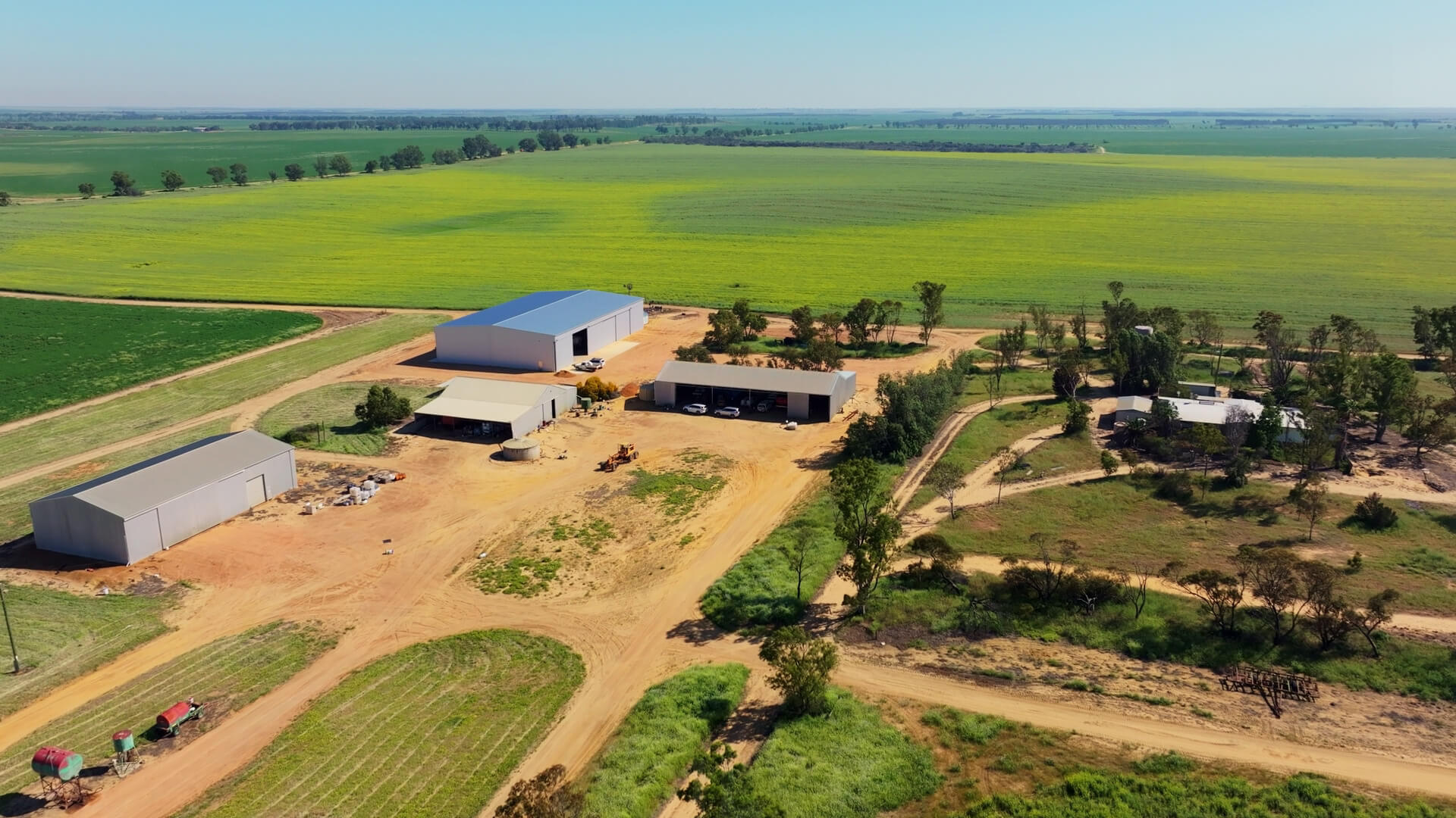 Overhead view of farm layout with paddocks and sheds
